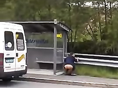 Desperate woman urinates next to the highway