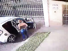 Suave girl takes a leak next to the car