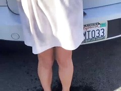 SHE CAN'T HOLD IT IN PARKING LOT
